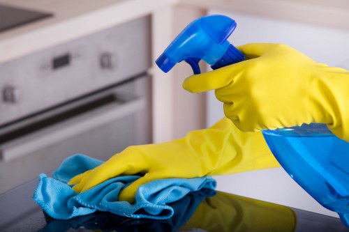 Kitchen surfaces being cleaned during move in cleaning