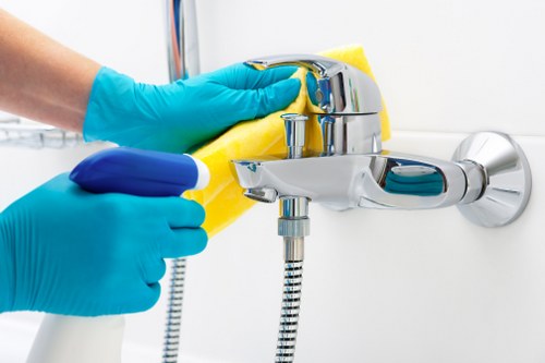 Commercial cleaning team sanitizing workplace surfaces
